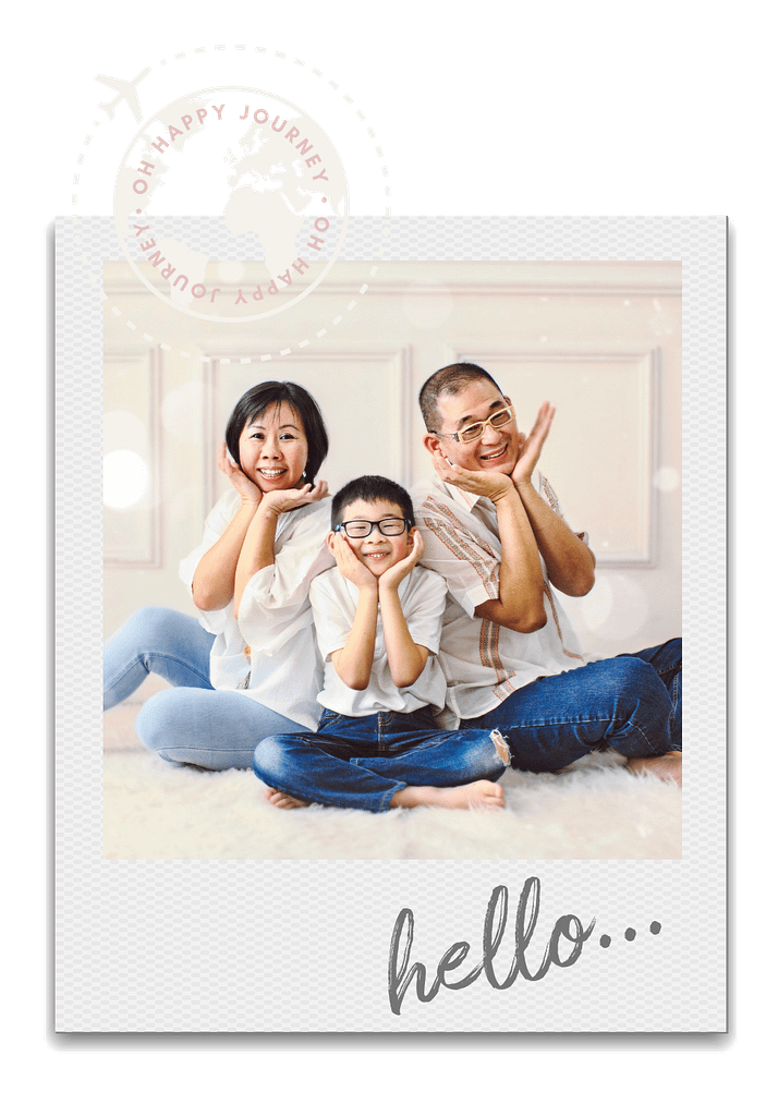 Mother, son, and father sitting on the floor for a family picture